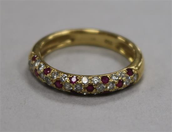 A modern 18ct gold and pave set diamond and ruby half hoop ring, size N.